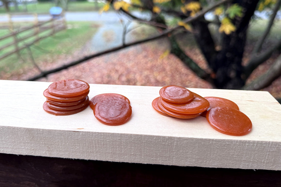 Hemanta and Aruna Super Golden button lac on a pale board, Virginia maples in fall color behind