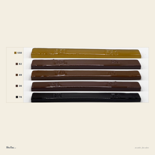 The Oak Six color chart — five Merit burn-in stick colors, each labeled with its number, honey amber through dark English oak