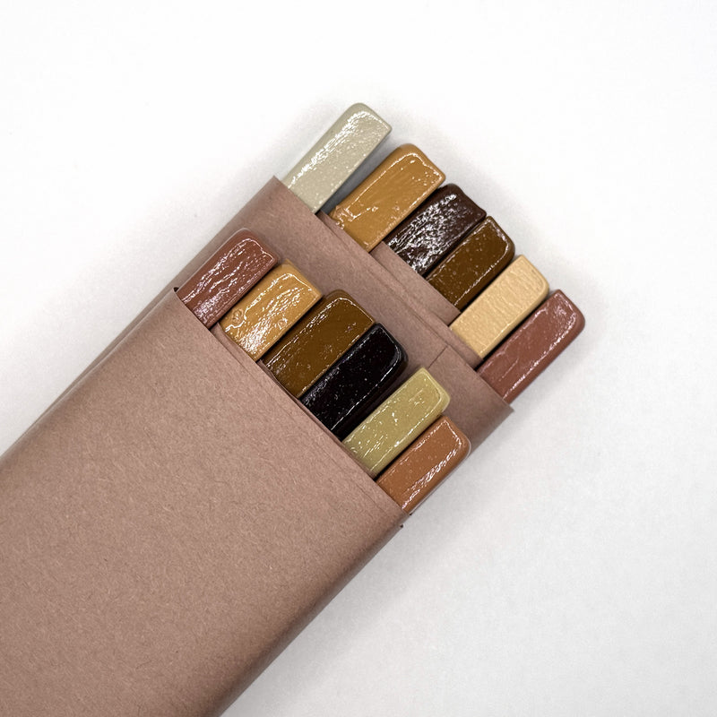 The Wood Tones Dozen, part-opened · our bench